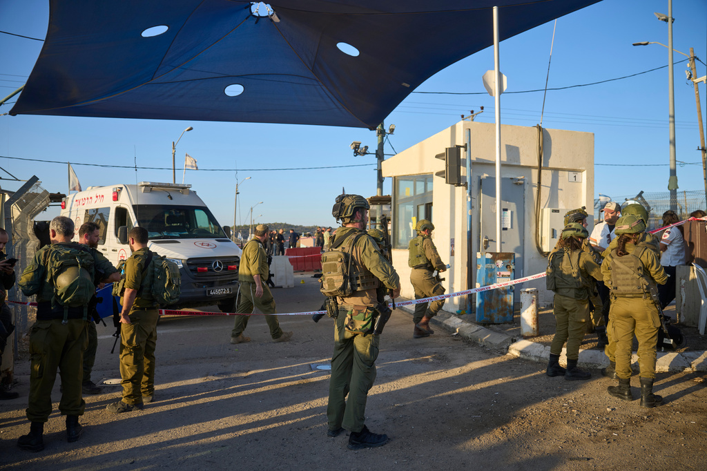 Israeli security forces inspect the scene where, according to police, a Palestinian man was shot and killed after ramming his car into a security checkpoint and seriously wounding an officer, near the West Bank Jewish settlement of Beit Horon, Wednesday, Sept. 23, 2026.(AP Photo/Ohad Zwigenberg)