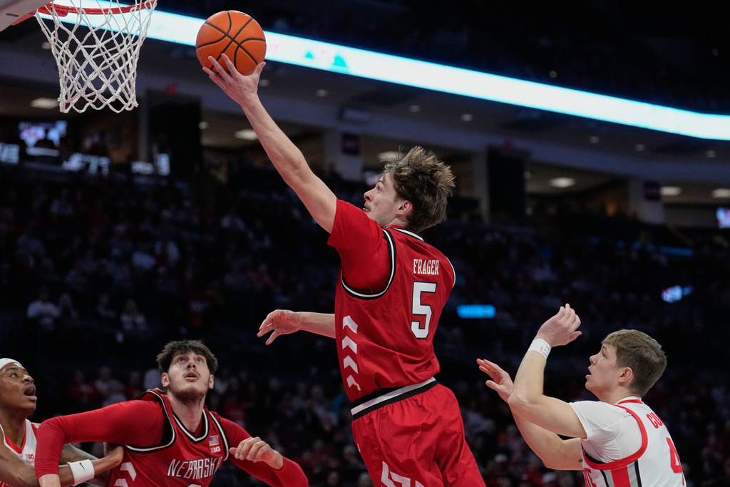 Nebraska forward Braden Frager (5) shoots in front of half Ohio State guard Gabe Cupps, right, in the first half of an NCAA college basketball game Monday, Jan. 5, 2026, in Columbus, Ohio. (AP Photo/Sue Ogrocki)