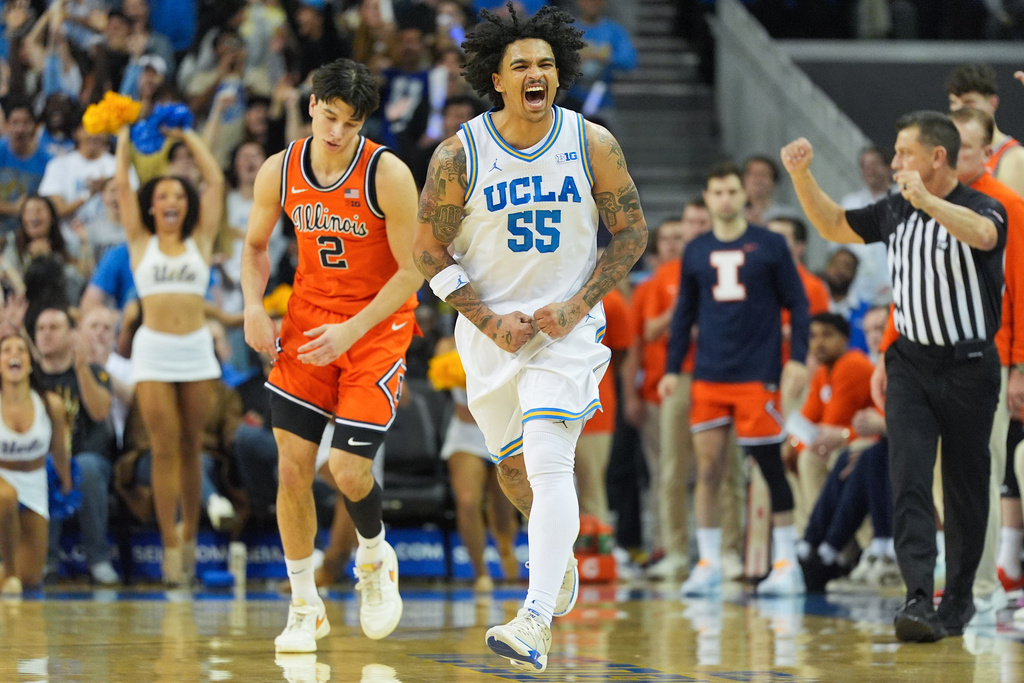 UCLA guard Skyy Clark (55) celebrates his basket during the first half of an NCAA college basketball game against Illinois in Los Angeles, Saturday, Feb. 21, 2026. (AP Photo/Jae C. Hong)