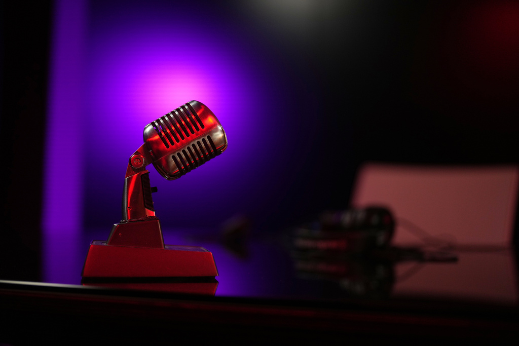 A replica of a microphone is placed in the TV studio set where imprisoned Turkish journalist Fatih Altayli continues to deliver comments on his YouTube show through letters read by his assistant, in Istanbul, Wednesday, Oct. 1, 2025. (AP Photo/Francisco Seco)