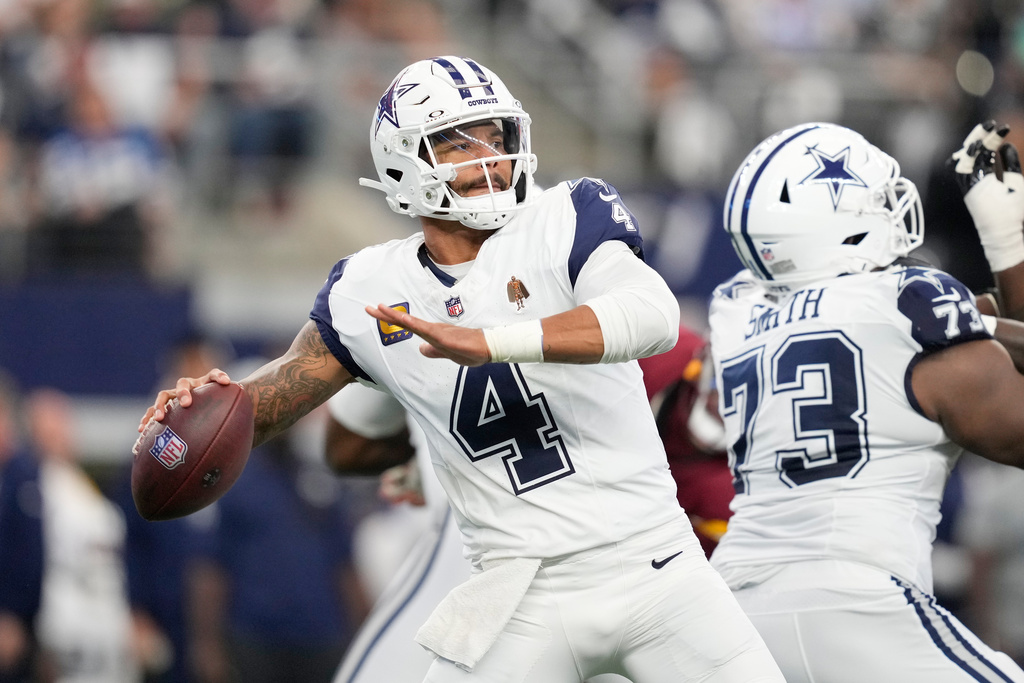 Dallas Cowboys quarterback Dak Prescott throws a pass against the Washington Commanders during the first half of an NFL football game Sunday, Oct. 19, 2025, in Arlington, Texas. (AP Photo/Tony Gutierrez)