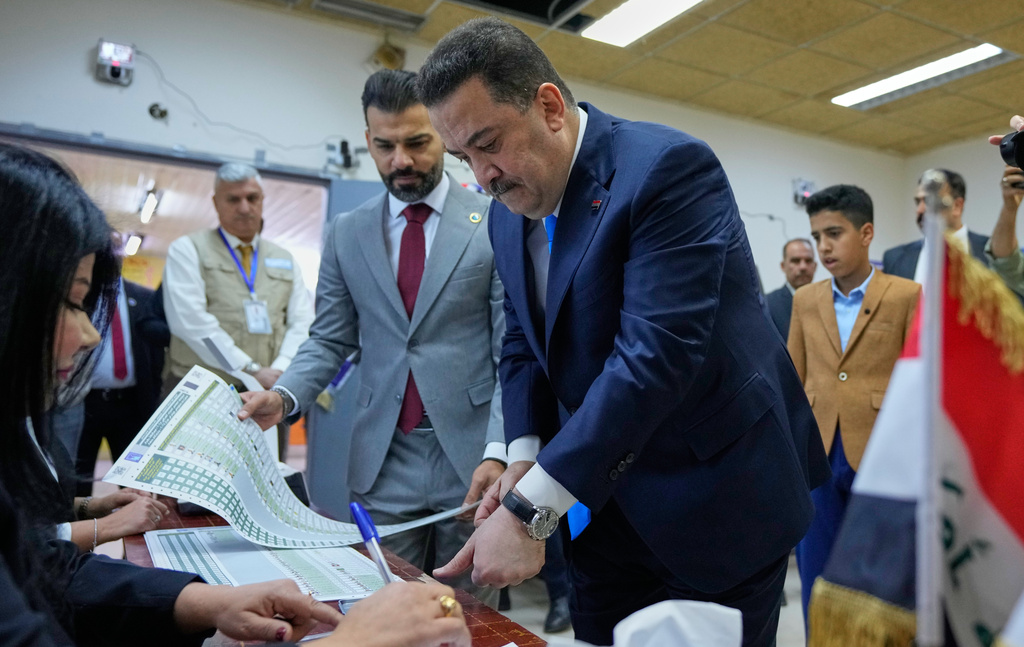 Iraqi Prime Minister Mohammed Shia al-Sudani his vote in the country's parliamentary election in Baghdad, Iraq, Tuesday, Nov. 11, 2025. (AP Photo/Hadi Mizban)