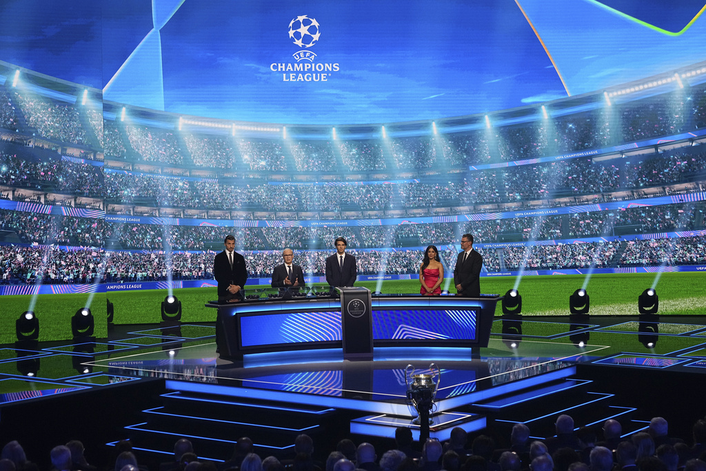 From left: Former soccer star Zlatan Ibrahimovic, UEFA Deputy General Secretary Giorgio Marchetti and former Brazilian player Kaka attend the Champions League soccer league phase draw in Monaco, Thursday, Aug. 28, 2025. (AP Photo/Laurent Cipriani)