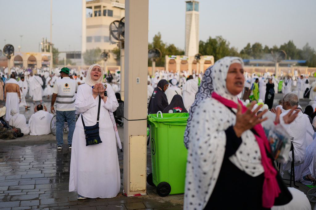 s pray in front of the rocky hill known as Mountain of Mercy, on the Plain of Arafat, during the annual Hajj pilgrimage near the holy city of Mecca, Saudi Arabia, Tuesday, May 26, 2026. (AP Photo/Altaf Qadri)