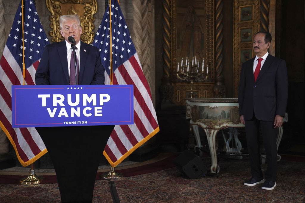 President-elect Donald Trump speaks as Hussain Sajwani, CEO of DAMAC Properties, listens during a news conference at Mar-a-Lago, Tuesday, Jan. 7, 2025, in Palm Beach, Fla. (AP Photo/Evan Vucci)