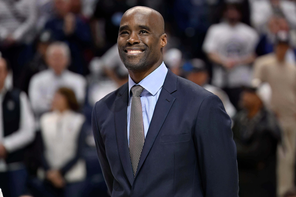 Former professional basketball player Emeka Okafor smiles during a ceremony retiring his number before NCAA college basketball game between UConn and Creighton, Wednesday, Feb. 18, 2026, in Storrs, Conn. (AP Photo/Jessica Hill)
