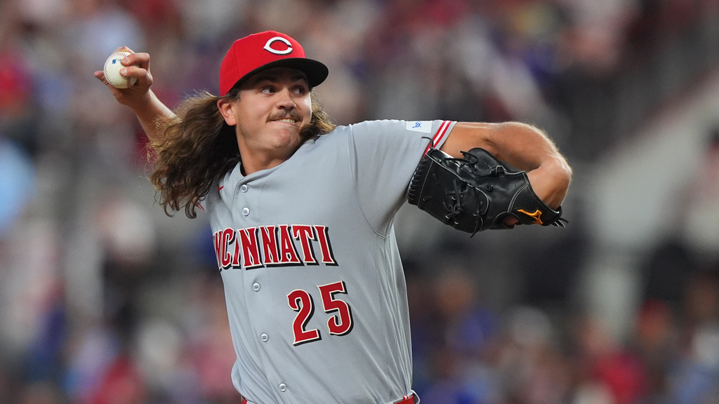 Cincinnati Reds starting pitcher Rhett Lowder throws during the first inning of a baseball game against the Texas Rangers, Saturday, April 4, 2026, in Arlington, Texas. (AP Photo/LM Otero)