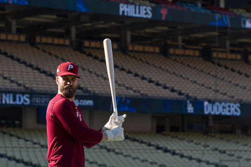 Philadelphia Phillies' Bryce Harper gets ready for batting practice Tuesday, Oct. 7, 2025, in Los Angeles, the day before Game 3 of baseball's National League Division Series against the Los Angeles Dodgers. (AP Photo/Jae C. Hong) Philadelphia Phillies' Bryce Harper gets ready for batting practice Tuesday, Oct. 7, 2025, in Los Angeles, the day before Game 3 of baseball's National League Division Series against the Los Angeles Dodgers. (AP Photo/Jae C. Hong)