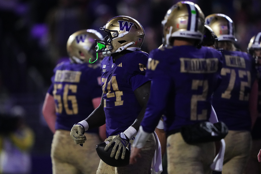 Washington running back Adam Mohammed (24) celebrates another touchdown against Purdue during the first half of an NCAA college football game, Saturday, Nov. 15, 2025, in Seattle. (AP Photo/Lindsey Wasson)