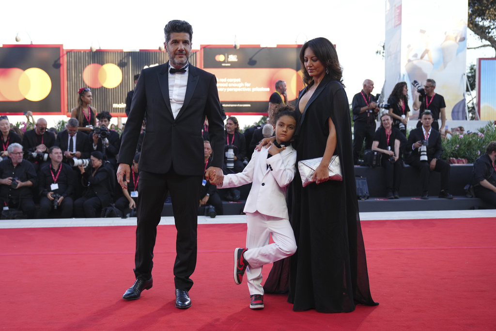 Nabil Ayouch, from left, Noam and Maryam Touzani pose for photographers upon arrival at the awards ceremony of the 82nd edition of the Venice Film Festival in Venice, Italy, on Saturday, Sept. 6, 2025. (Photo by Alessandra Tarantino/Invision/AP)