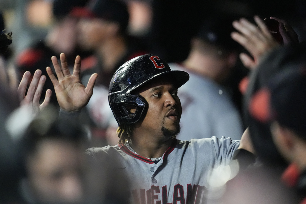 Cleveland Guardians third baseman José Ramírez (11) celebrates scoring off the bat of Bo Naylor in the first inning of a baseball game against the Minnesota Twins, Friday, Sept. 19, 2025, in Minneapolis. (AP Photo/Mike Stewart)