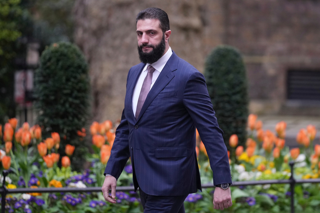 FILE - President of Syria Ahmed al-Sharaa walks towards 10 Downing Street to meet Britain's Prime Minister Keir Starmer in London, on March 31, 2026. (AP Photo/Alastair Grant, File)