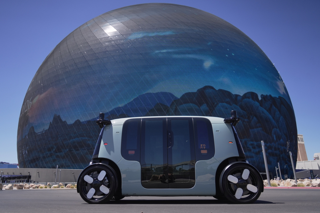An Amazon Zoox taxi with no steering wheel drives in front of The Sphere on the Las Vegas strip, Thursday, July 30, 2026. (AP Photo/Ty ONeil)
