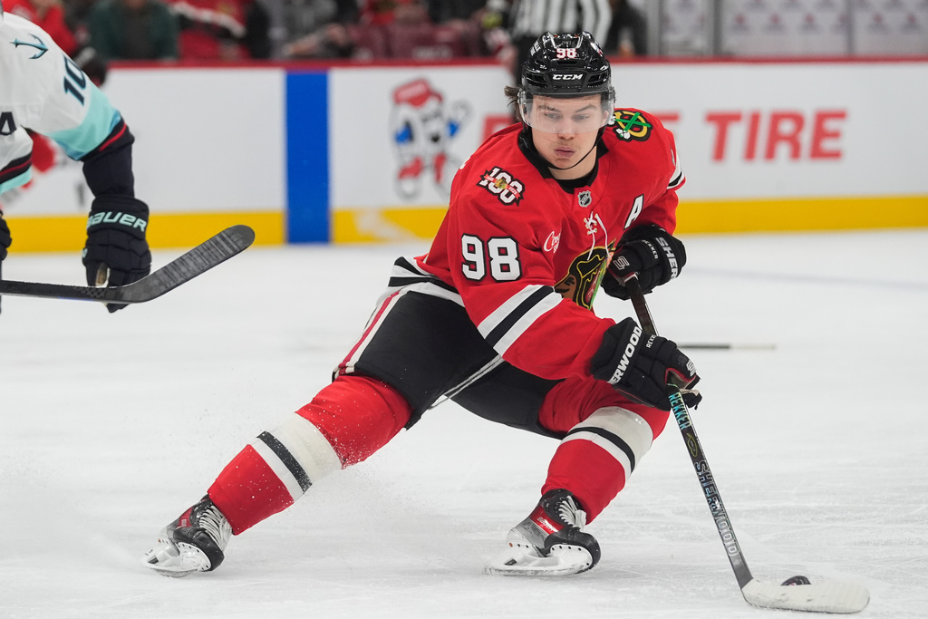FILE - Chicago Blackhawks center Connor Bedard handles the puck during the second period of an NHL hockey game against the Seattle Kraken, Nov. 20, 2025, in Chicago. (AP Photo/Erin Hooley, File)