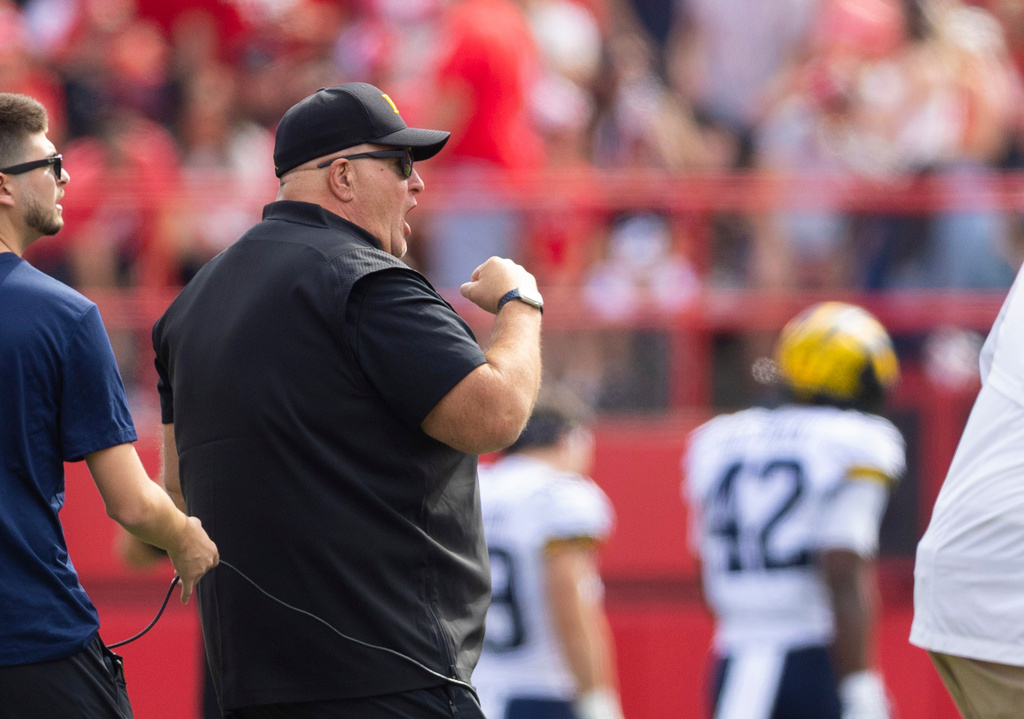 FILE - Michigan acting head coach Biff Poggi reacts after his team made a field goal against Nebraska during the first half of an NCAA college football game Saturday, Sept. 20, 2025, in Lincoln, Neb. (AP Photo/Rebecca S. Gratz, File)