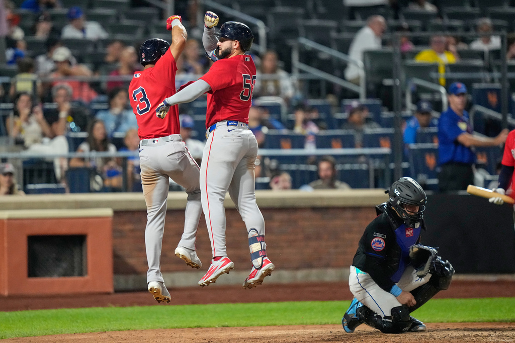 Boston Red Sox's Wilyer Abreu (52) celebrates with Ceddanne Rafaela (3) after they scored on a two-run home run by Abreu as New York Mets catcher Francisco Alvarez reacts of a baseball game Friday, July 10, 2026, in New York. (AP Photo/Frank Franklin II)