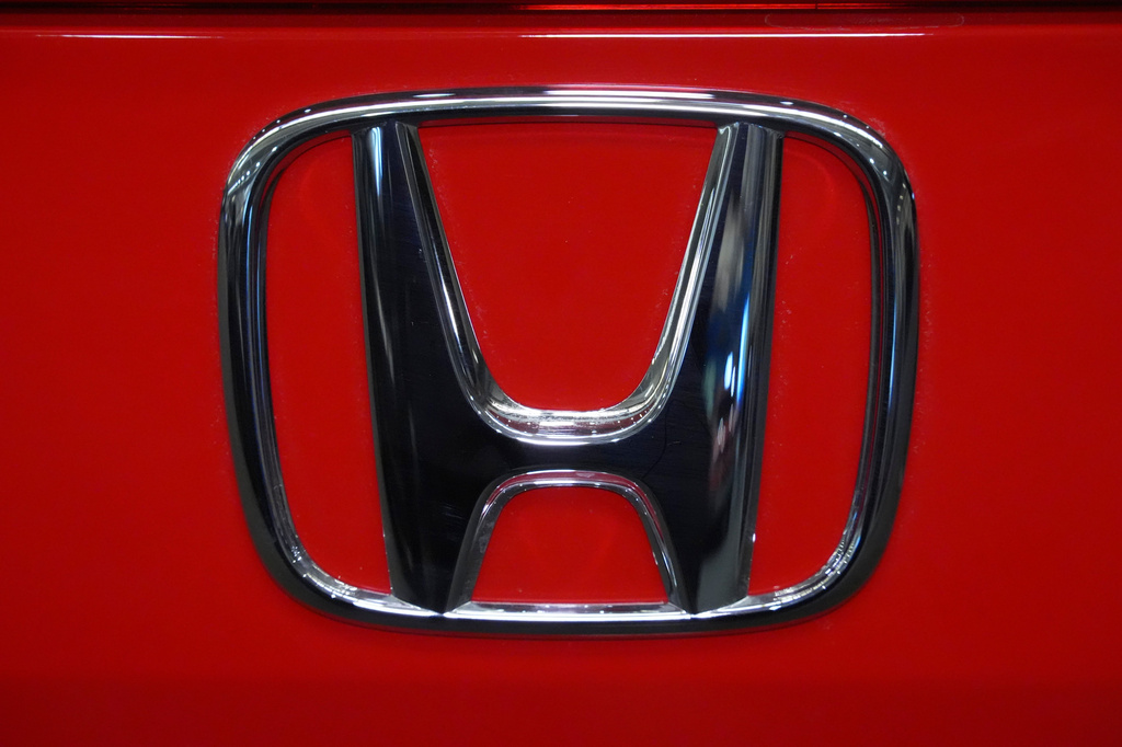 FILE - This is the Honda logo on a Honda Civic Sport Touring automobile on display at the Pittsburgh International Auto Show in Pittsburgh, Feb. 14, 2025. (AP Photo/Gene J. Puskar, file)