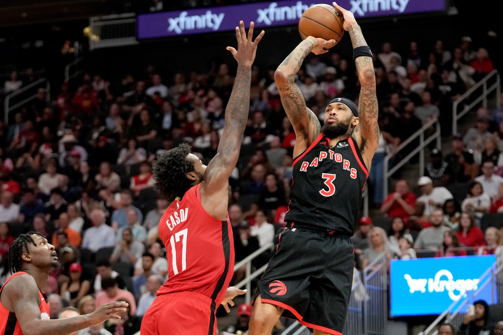 Toronto Raptors forward Brandon Ingram (3) shoots as Houston Rockets forward Tari Eason (17) defends during the second half of an NBA basketball game, Tuesday, March 10, 2026, in Houston. (AP Photo/Eric Christian Smith)