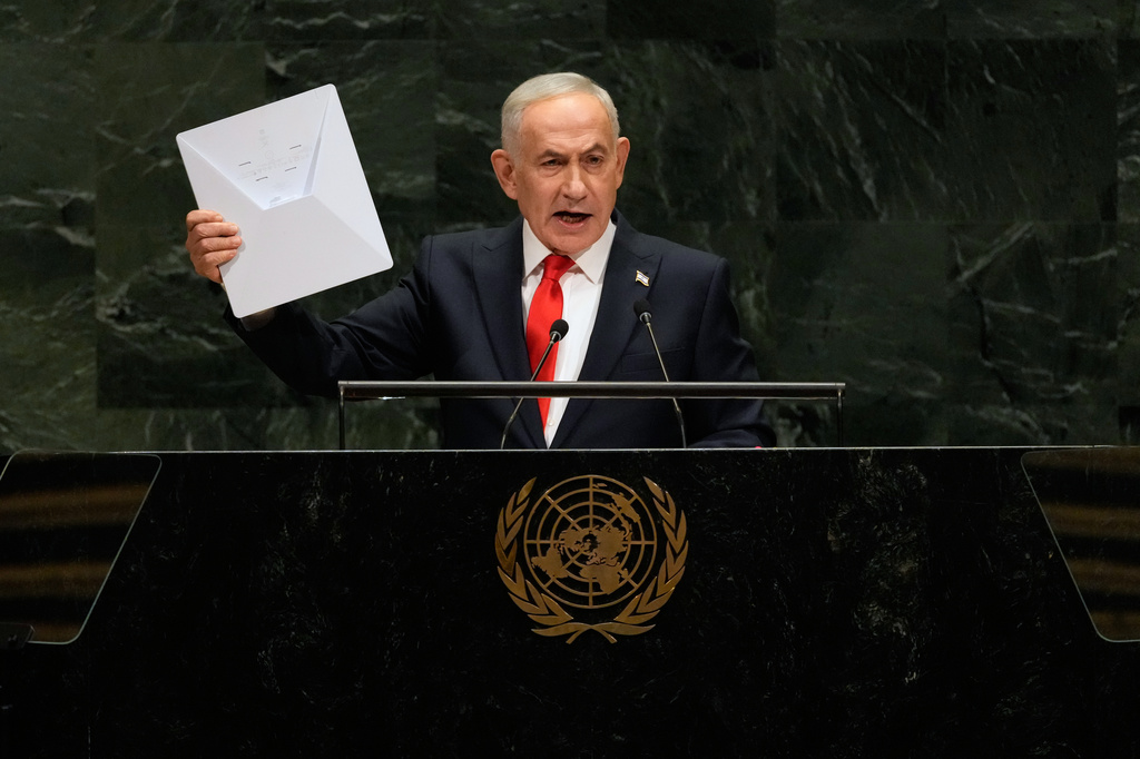 Israeli Prime Minister Benjamin Netanyahu holds up a Starlink satellite internet dish a he speaks during the 81st session of the United Nations General Assembly at United Nations headquarters, Thursday, Sept. 24, 2026. (AP Photo/Seth Wenig)