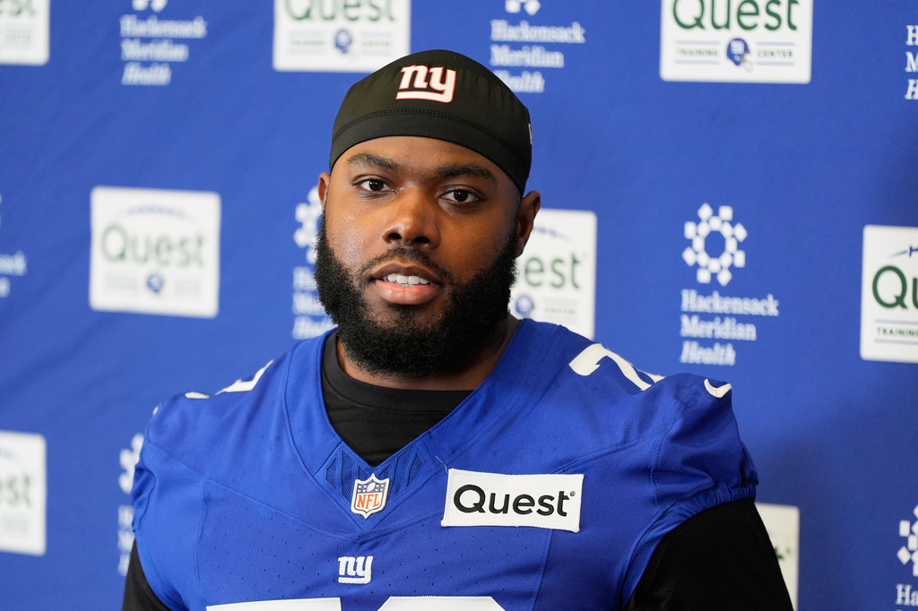 FILE - New York Giants' Andrew Thomas speaks to reporters after NFL football practice in East Rutherford, N.J., May 21, 2026. (AP Photo/Seth Wenig, file)
