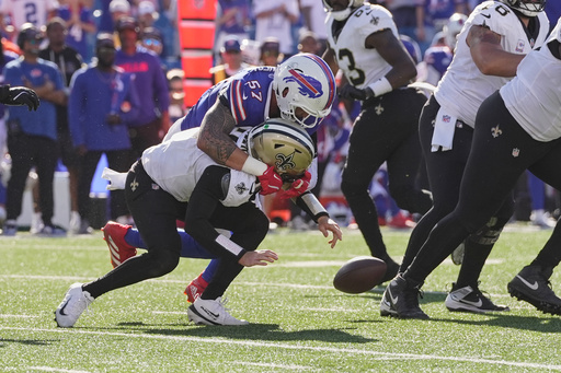 New Orleans Saints quarterback Spencer Rattler (2) fumbles as he is hit by Buffalo Bills defensive end AJ. Epenesa (57) in the second half of an NFL football game, Sunday, Sept. 28, 2025, in Orchard Park, N.Y. (AP Photo/Sue Ogrocki) New Orleans Saints quarterback Spencer Rattler (2) fumbles as he is hit by Buffalo Bills defensive end AJ. Epenesa (57) in the second half of an NFL football game, Sunday, Sept. 28, 2025, in Orchard Park, N.Y. (AP Photo/Sue Ogrocki)