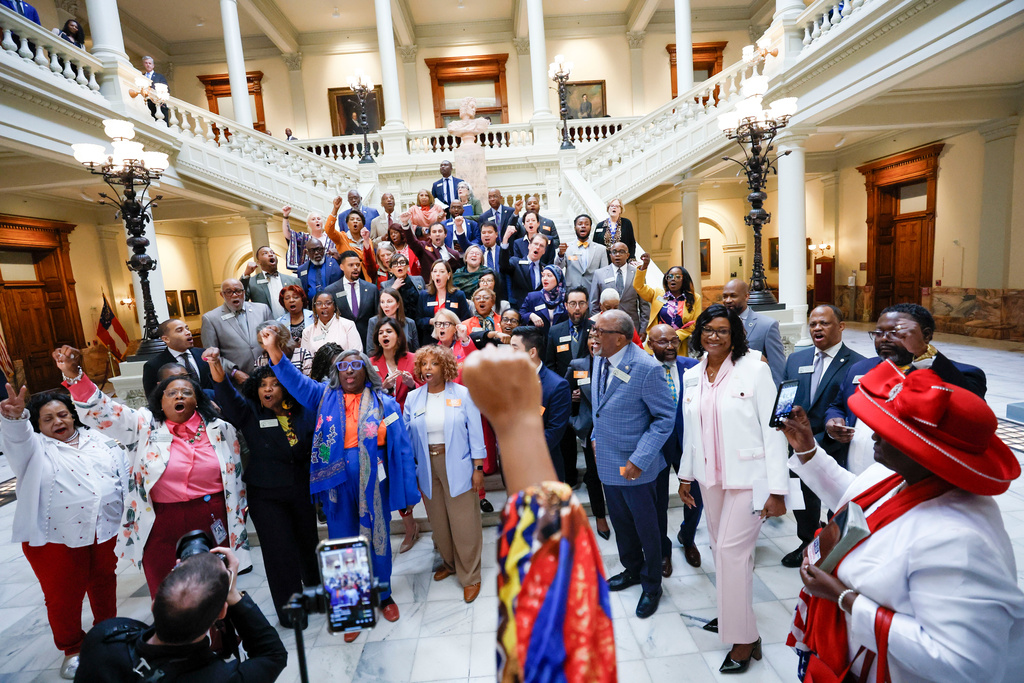 FILE - Georgia House Democrats walk out of the House Chamber in protest, after Senate Bill 185, which would outlaw spending on gender affirming care for transgender prisoners, was introduced at the state Capitol, April 2, 2025, in Atlanta. (Miguel Martinez/Atlanta Journal-Constitution via AP, File)