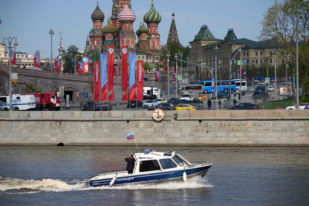 A police boat patrol the waters of the Moskva River near Red Square decorated for the celebrations of the 81st anniversary of the Soviet Union's victory over Nazi Germany at World War II during the Victory Day military parade rehearsal in Moscow, Russia, Thursday, May 7, 2026, backdropped by the St. Basil's Cathedral. (AP Photo/Alexander Zemlianichenko)