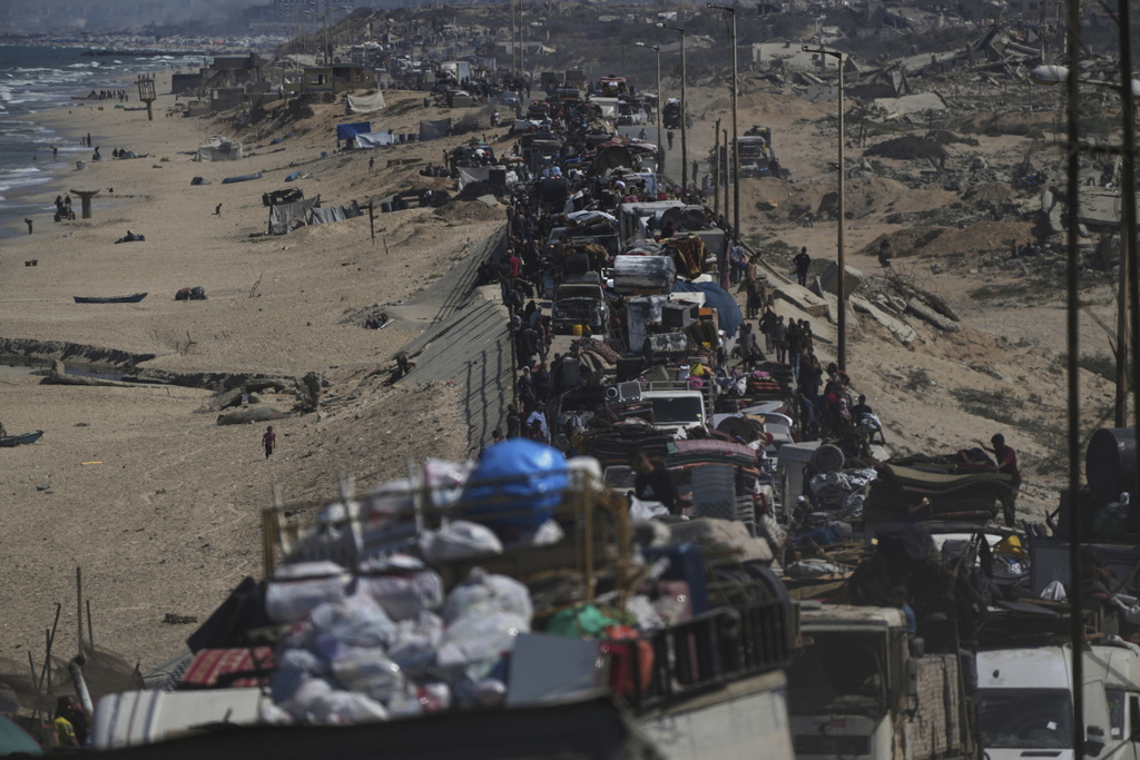 Displaced Palestinians flee northern Gaza along the coastal road toward the south, after Israel's military says its expanded operation in Gaza City has begun and warns residents to leave, Tuesday, Sept. 16, 2025. (AP Photo/Abdel Kareem Hana)