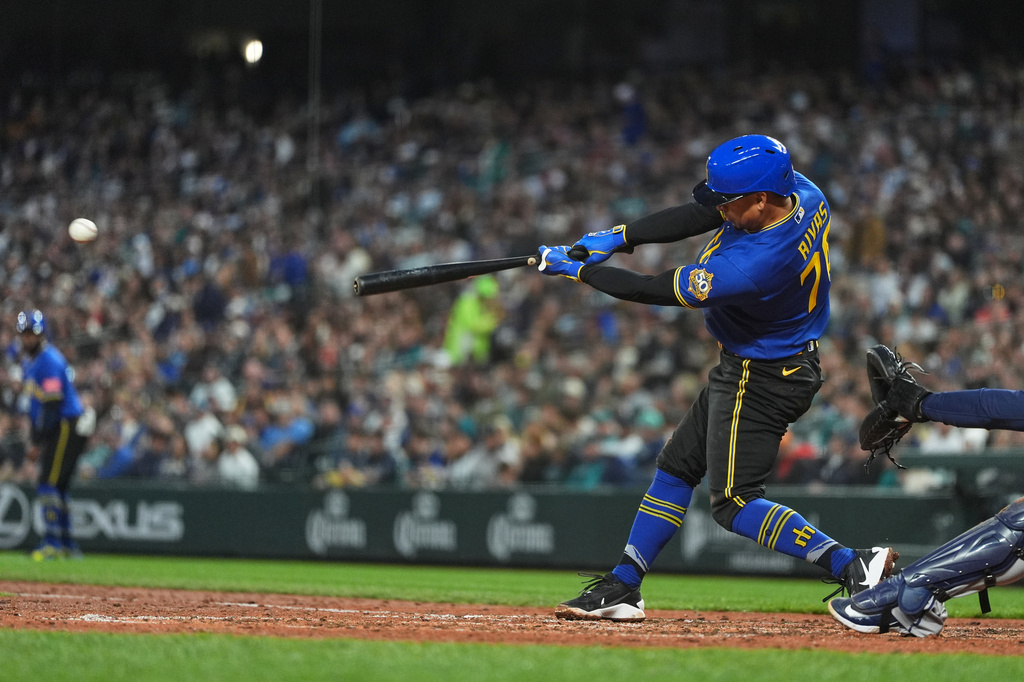 Seattle Mariners' Leo Rivas hits a single against the Houston Astros during the fourth inning of a baseball game, Friday, April 10, 2026, in Seattle. (AP Photo/Lindsey Wasson)