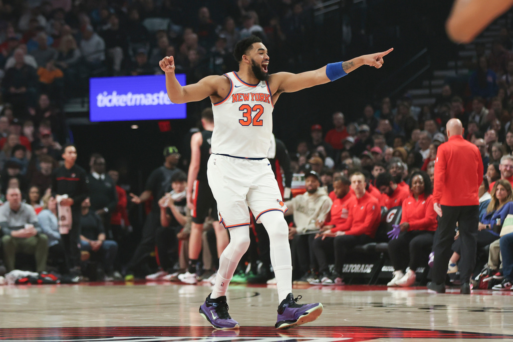 New York Knicks center/forward Karl-Anthony Towns reacts after a basket against the Portland Trail Blazers during the first half of an NBA basketball game Sunday, Jan. 11, 2026, in Portland, Ore. (AP Photo/Amanda Loman)