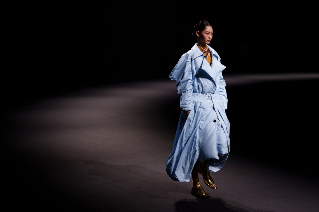 A model wears a creation by Shengze Silk during China Fashion Week (Spring) 2026 in Beijing, China, Tuesday, March 24, 2026. (AP Photo/Vincent Thian)