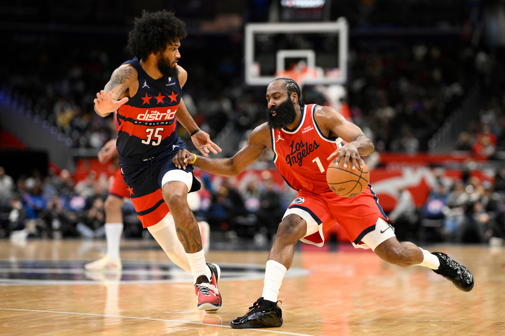 Los Angeles Clippers guard James Harden (1) dribbles against Washington Wizards forward Marvin Bagley III (35) during the first half of an NBA basketball game, Monday, Jan. 19, 2026, in Washington. (AP Photo/Nick Wass)