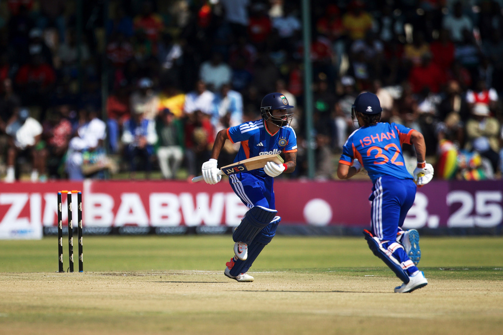 India's captain Shreyas Iyer, left, with his batting partner Ishan Kishan run between the wickets during the second T20 cricket match between Zimbabwe and India in Harare, Zimbabwe, Saturday, July 25, 2026. (AP Photo/Wonder Mashura)