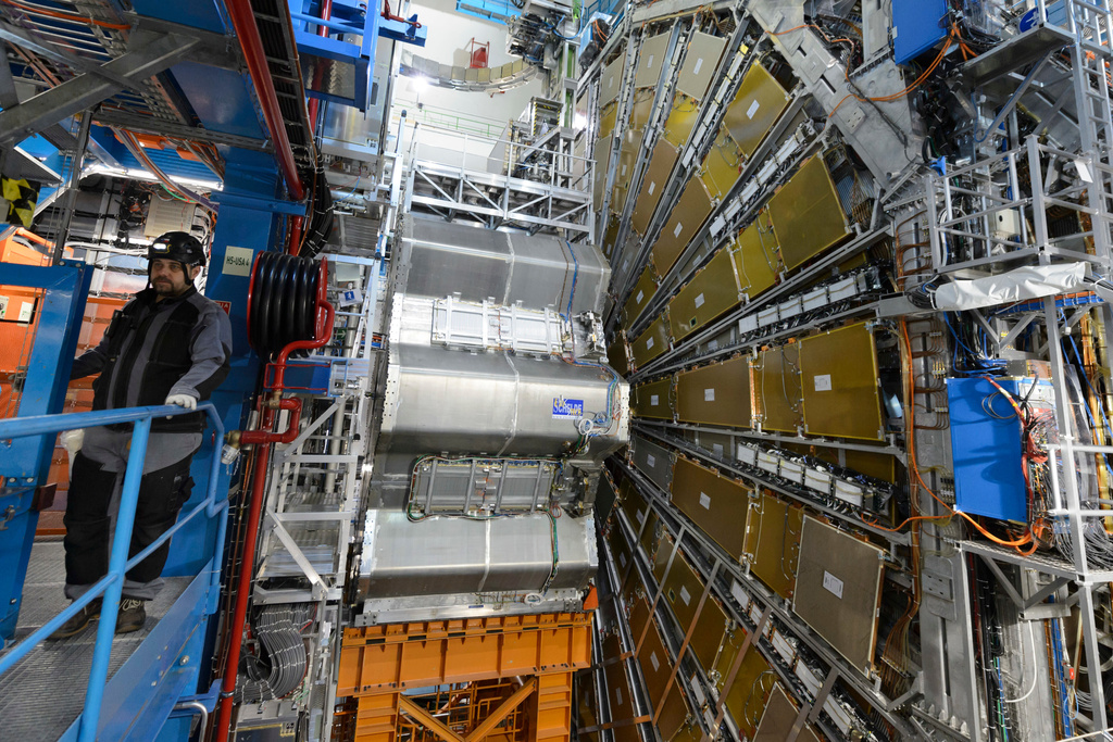 FILE - A technician works in the LHC (Large Hadron Collider) tunnel of the European Organization for Nuclear Research, CERN, during a press visit in Meyrin, near Geneva, Switzerland, Feb. 16, 2016. (Laurent Gillieron/Keystone via AP, File)