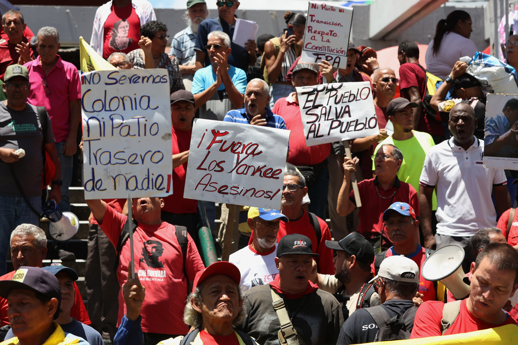 Venezuelans protest against President Donald Trump's deal giving the United States a stake in Venezuela’s oil reserves in Caracas, Saturday, Aug 29, 2026. (AP Photo/Pedro Mattey)