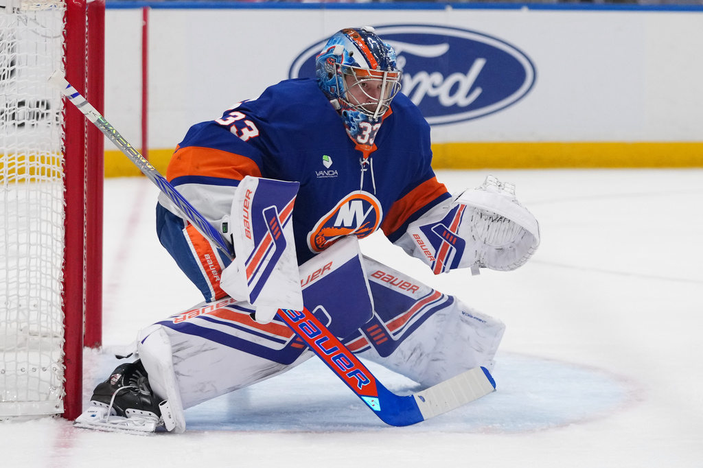 New York Islanders goaltender David Rittich protects the net during the first period of an NHL hockey game against the Carolina Hurricanes Tuesday, April 14, 2026, in Elmont, N.Y. (AP Photo/Frank Franklin II)