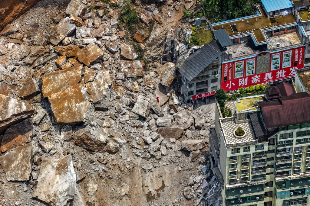 In this photo released by Xinhua News Agency, rescuers conduct search and rescue operation on the site of the landslide in Pengshui County in southwestern China's Chongqing on Friday, July 17, 2026. (Huang Wei/Xinhua via AP)