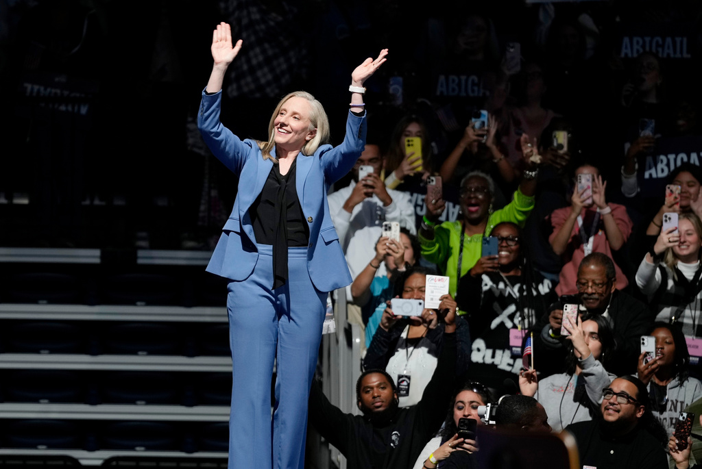 Virginia Democratic gubernatorial candidate Abigail Spanberger arrives on stage during a campaign event with former President Barack Obama, Saturday, Nov. 1, 2025, in Norfolk, Va. (AP Photo/Steve Helber)