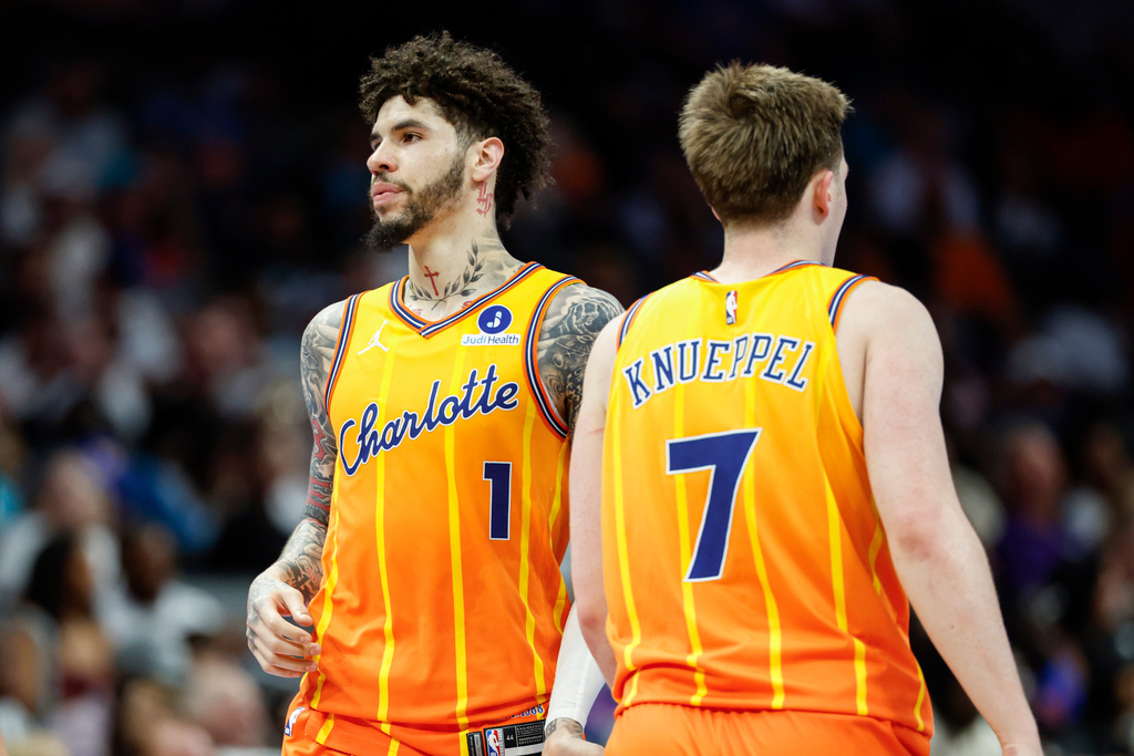 Charlotte Hornets guards LaMelo Ball (1) and Kon Knueppel stands on the court during the second half of an NBA basketball game against the Detroit Pistons in Charlotte, N.C., Friday, April 10, 2026. (AP Photo/Nell Redmond)