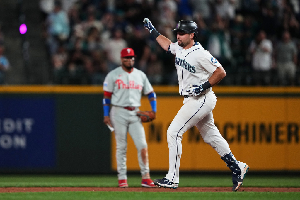 Seattle Mariners' Cal Raleigh jogs the bases after hitting a solo home run against the Philadelphia Phillies during the fifth inning of a baseball game, Monday, Aug. 24, 2026, in Seattle. (AP Photo/Lindsey Wasson)