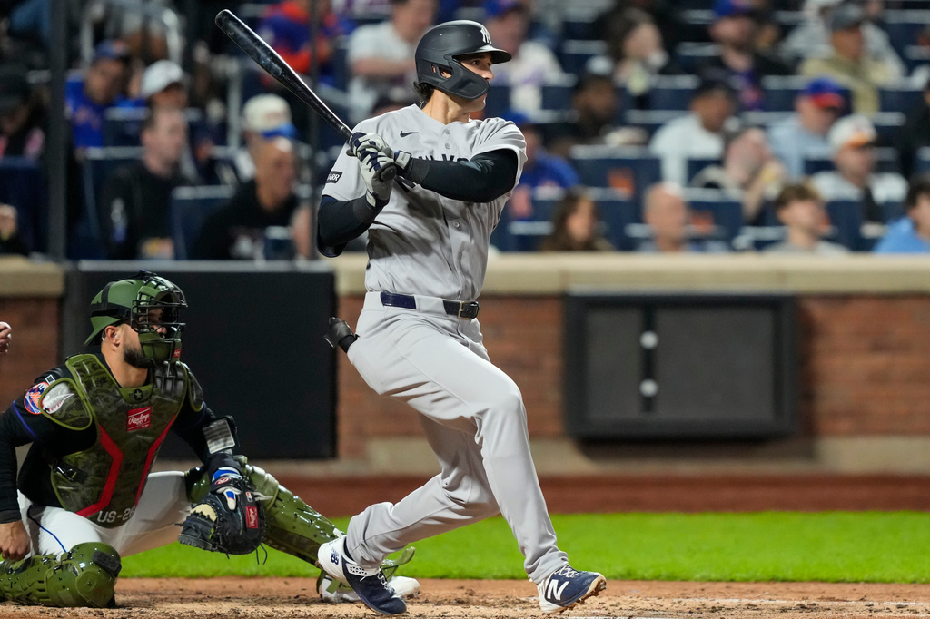 New York Yankees designated hitter Spencer Jones hits an RBI single during the fifth inning of a baseball game against the New York Mets, Friday, May 15, 2026, in New York. (AP Photo/Yuki Iwamura)