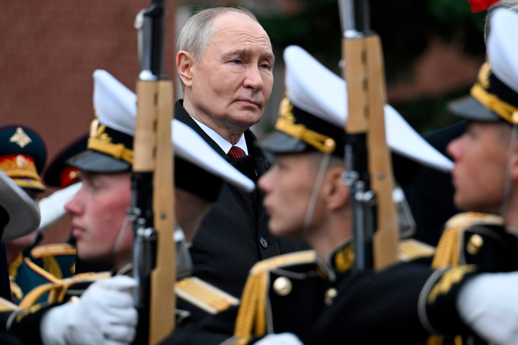 FILE - Russian President Vladimir Putin, rear center, attends a ceremony to lay flowers at the Tomb of the Unknown Soldier by the Kremlin wall in Moscow, Saturday, May 9, 2026, during celebrations of the 81st anniversary of the Soviet Union's victory over Nazi Germany during the World War II. (Alexander Nemenov/Pool Photo via AP, File)