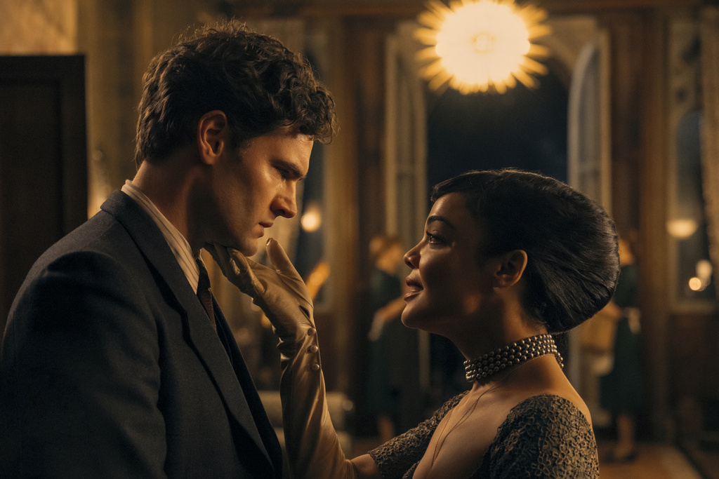 This image released by Amazon Prime shows Tom Bateman, left, and Tessa Thompson in a scene from "Hedda." (Parisa Taghizadeh/Amazon Prime via AP)
