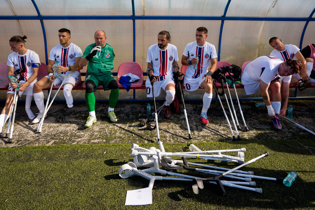 FCSB's players sit on the bench during an amputee soccer match between FCSB and AFAS in the inaugural EAFF Conference League in Bucharest, Romania, Thursday, Sept. 24, 2026. (AP Photo/Andreea Alexandru)