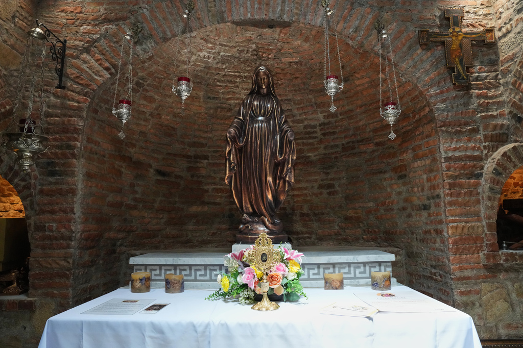 A statue of Mary modeled after the one in Turkey, alongside a relic said to be from her veil inside the Ephesus House, a replica of the House of the Virgin Mary in Ephesus, Turkey, at Alfonso town, Cavite province, Philippines on July 16, 2026. (AP Photo/Aaron Favila)