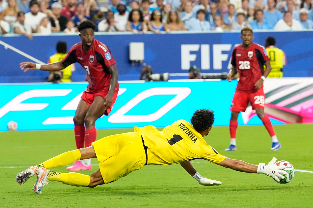 Cape Verde goalkeeper Vozinha (1) dive stopped take the ball during the World Cup Group H soccer match between Uruguay and Cape Verde in Miami Gardens, Fla., Sunday, June 21, 2026. (AP Photo/Rebecca Blackwell)