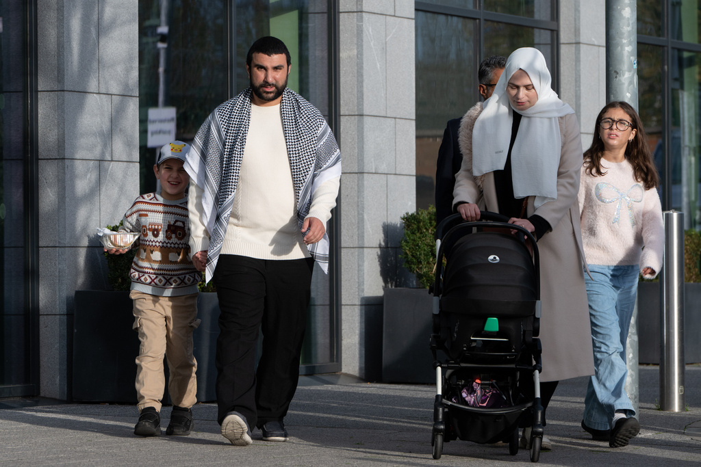 British political commentator Sami Hamdi arrives to speak to the media in London, Thursday, Nov. 13, 2025, on his return to the U.K. after he was arrested by Immigration and Customs Enforcement on Oct. 26 while on a speaking tour in the U.S.. (AP Photo/Thomas Krych)
