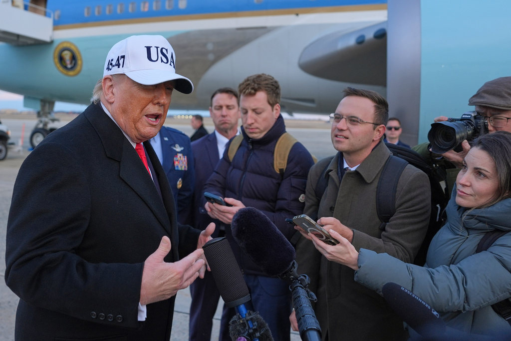 President Donald Trump speaks with reporters at Joint Base Andrews, Tuesday, Jan. 13, 2026, in Joint Base Andrews, Md. (AP Photo/Evan Vucci)