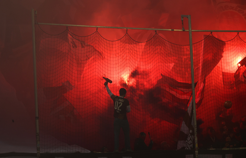 St. Pauli fans set off pyrotechnics before the Bundesliga soccer match between St. Pauli and Hamburger in Hamburg, Germany, Friday Jan. 23, 2026. (Christian Charisius/dpa via AP)