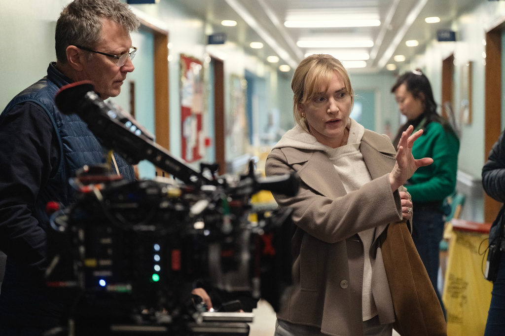 This image released by Netflix shows actor-director Kate Winslet, right, on the set of "Goodbye June." (Netflix via AP)